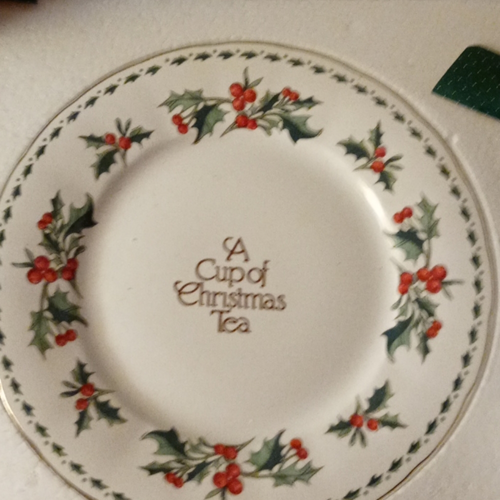 A cup of Christmas tea plate